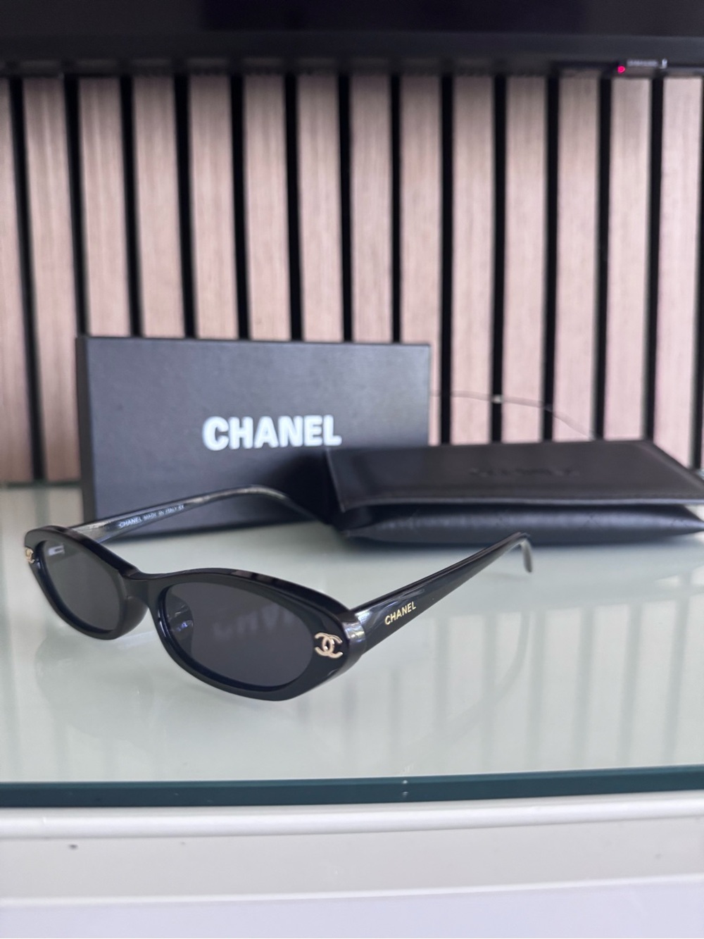CHANEL Black Oval Sunglasses with Gold CC Accent